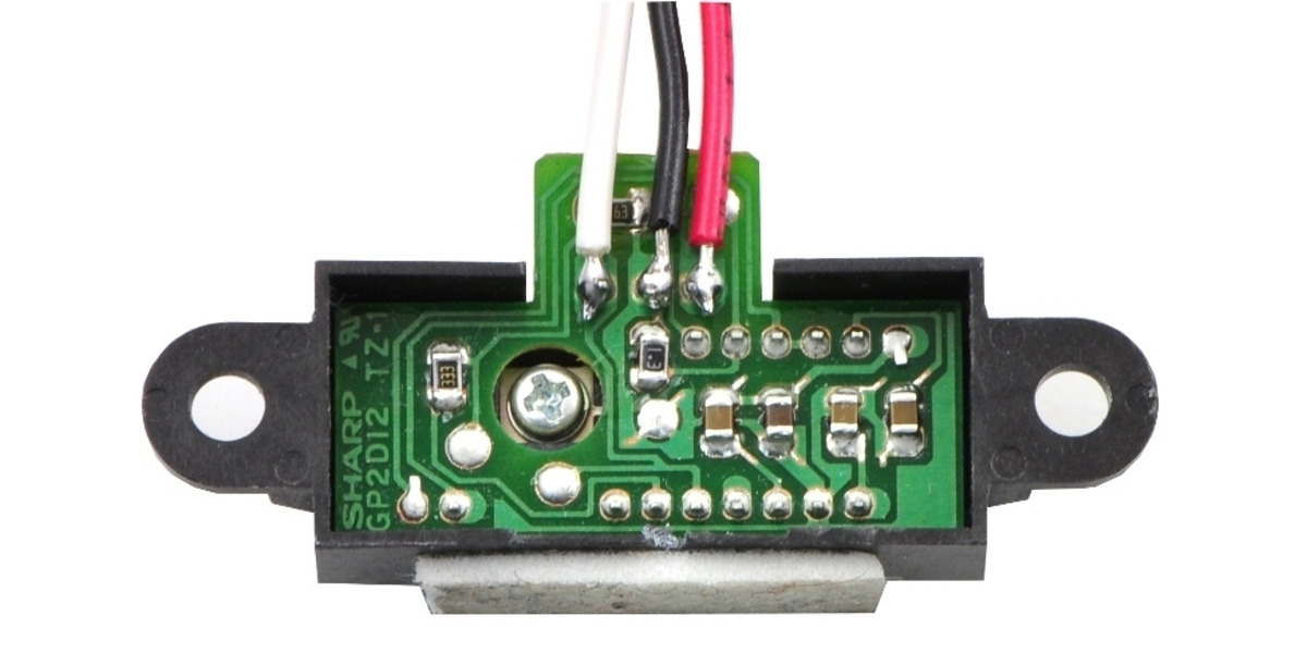 Sharp Distance Sensor Circuit Pololu - Sharp distance sensor with connected wires and double sided tape.